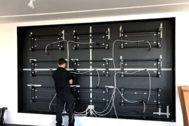 AV technician installing audio visual equipment in Dubai
